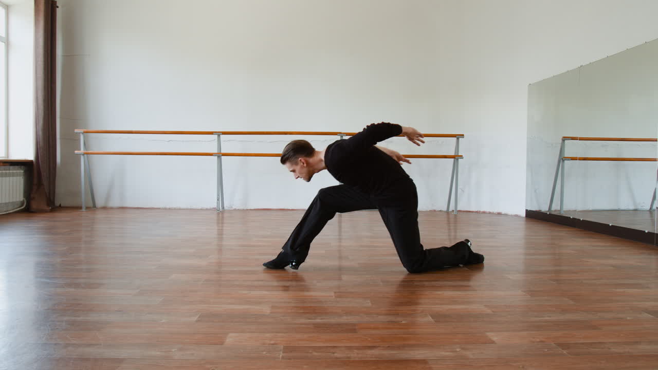 Male Dancer Practicing Ballroom Moves and Poses in a Studio