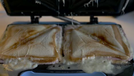 close up of a grilled cheese toaster sandwich maker bread breakfast cheese