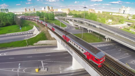 moving suburban electric train on the bridge near the junction