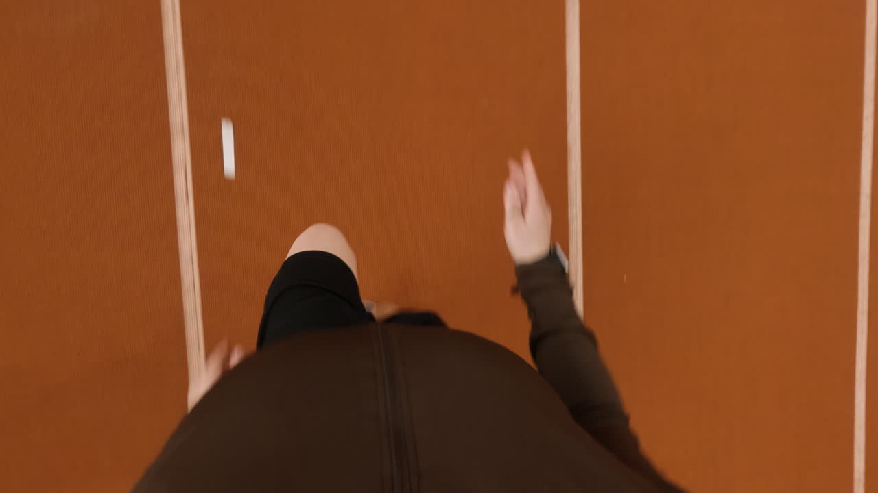 Overhead View of a Person Running on an Athletic Track