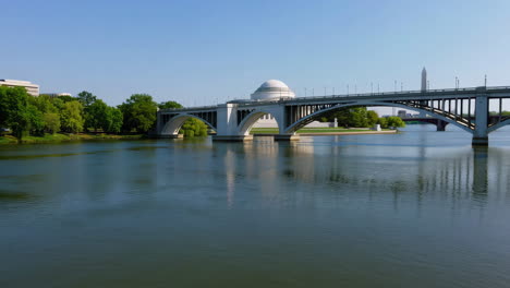 tidal basin bridge in washington d.c. with memorial reflections