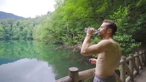 athlete man is drinking water.