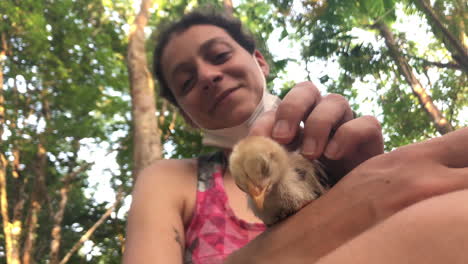 Girl-petting-chick-in-the-Amazon-rainforest