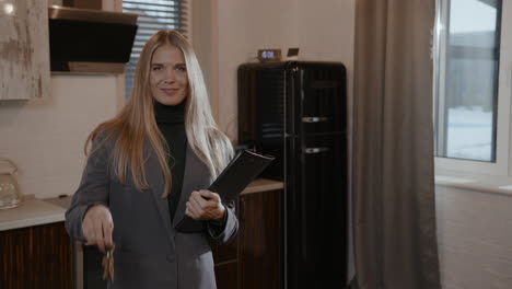 real estate agent posing with keys