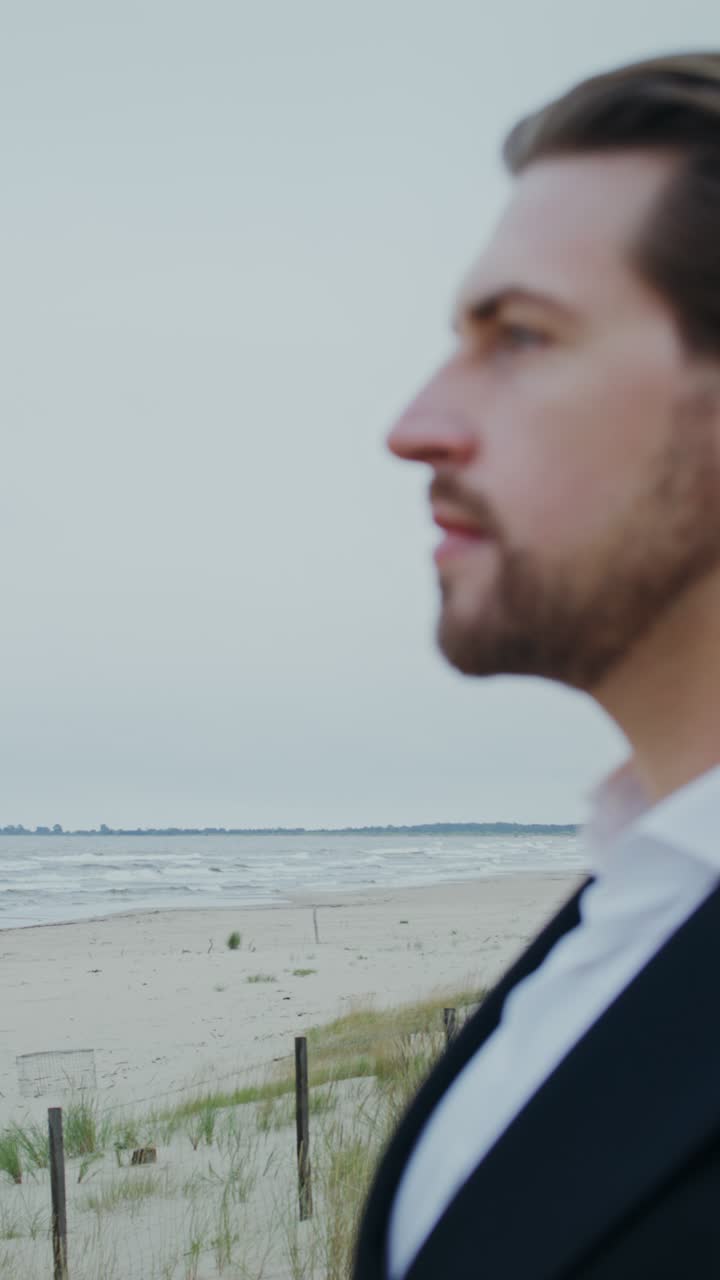 Man in suit on the beach