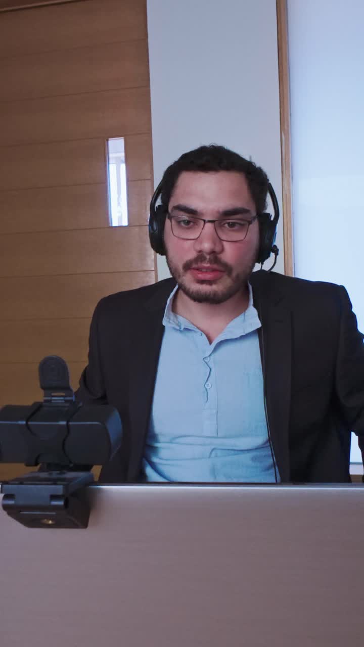 Professional Man Looking Directly at the Webcam for a Meeting