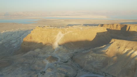 aerial: masada ancient fortress in the judean desert at sunrise