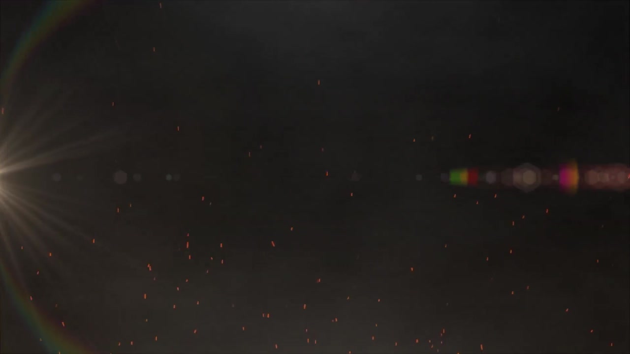 검은 바탕에 있는 불꽃과 빛의 반점의 애니메이션