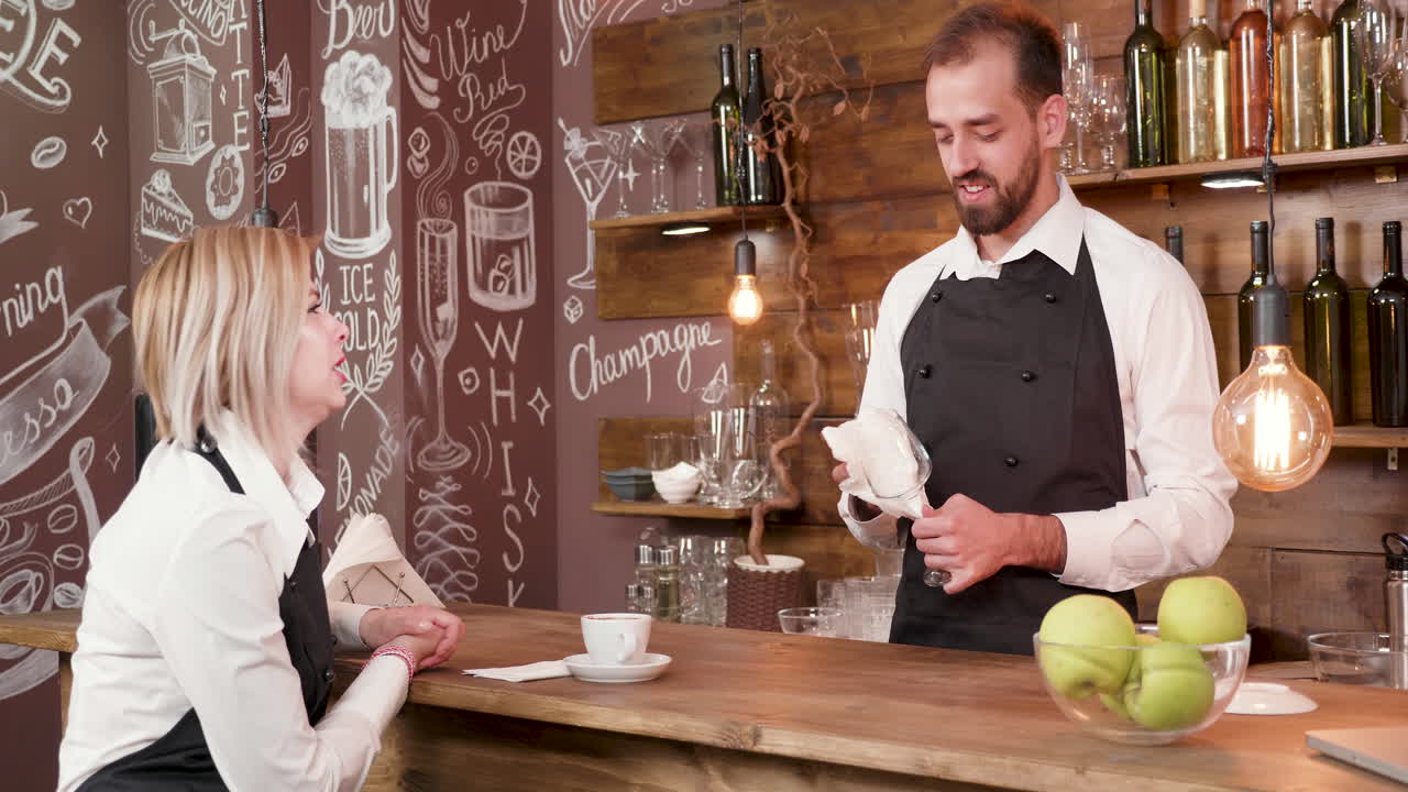Bartender serving a customer in a cafe bar