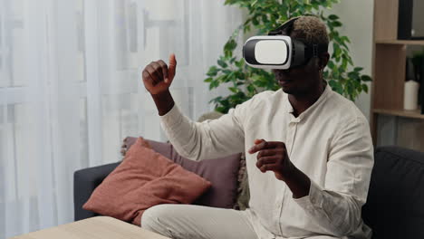 man using vr headset at home