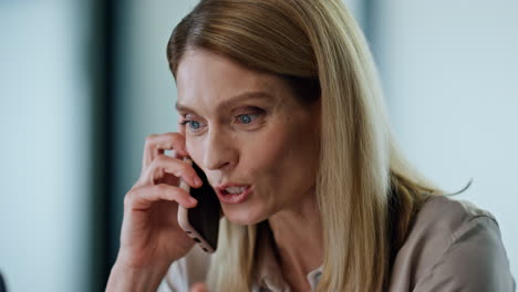 excited lady talking smartphone office portrait. happy businesswoman rejoicing