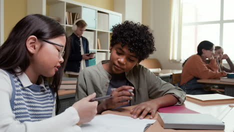 Students collaborating and studying in a classroom