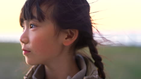 girl, face and smile, happy in a field having fun