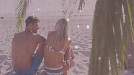 couple sitting on tropical beach for travel marketing, with animated palm frond and location icon