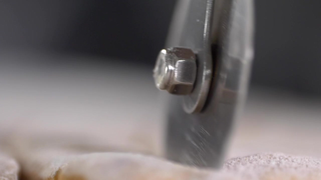Pizza Cutter cutting Pasta Dough