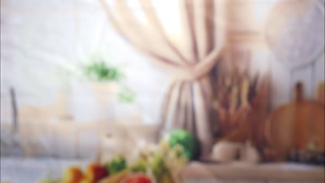 a close-up of a hand lifting a chocolate-drizzled granola bar with oats and nuts, as the camera smoothly follows the upward motion. the scene is set in a softly lit home kitchen environment.