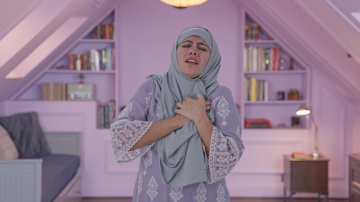 Muslim woman having a Heart attack