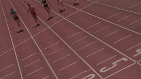 a group of five women run a race