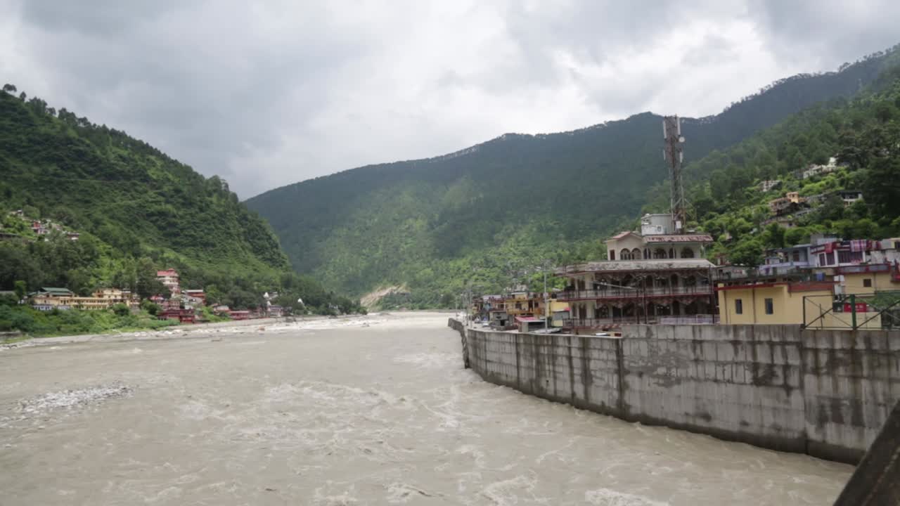 Himalaya mountainous river Ganges flowing through Himalaya villages - cities in Uttarakhand, India.