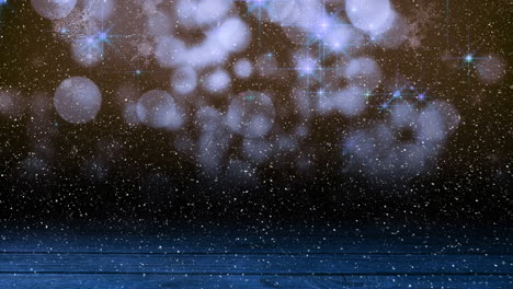 animación de nieve cayendo sobre puntos brillantes de luz con espacio de copia y superficie de madera