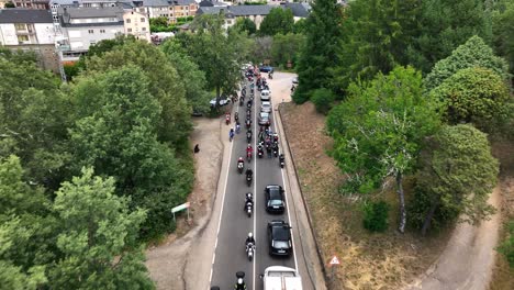 biker club leaving a city, aerial drone view