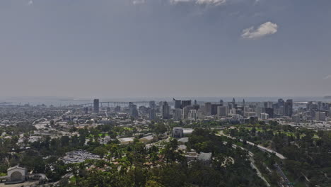 san diego california aerial v64 flyover balboa park with bay views capturing downtown cityscape and airplane flying across the sky, landing at the airport - shot with mavic 3 cine - september 2022