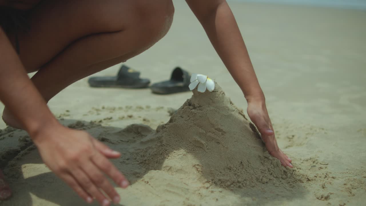 Building a sandcastle on the beach