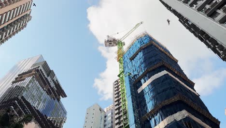 modern skyscraper under construction in hong kong city