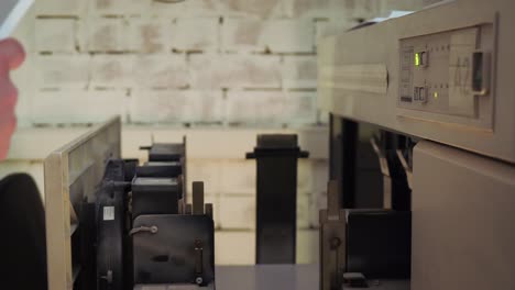 person maintaining a large-scale printing machine