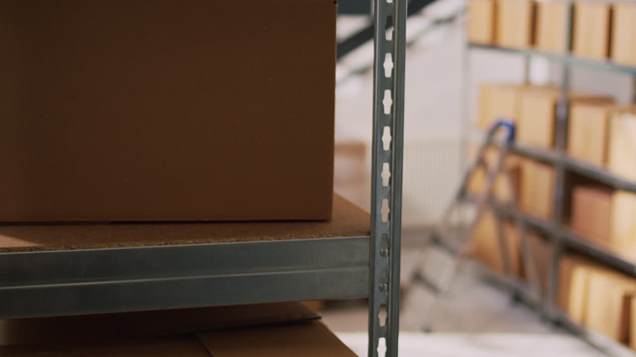 Warehouse workers checking inventory using laptop