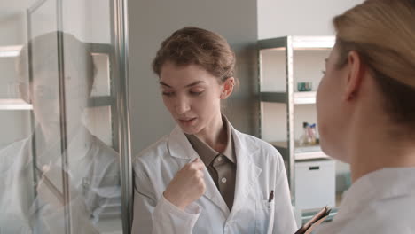 two female scientists in a discussion