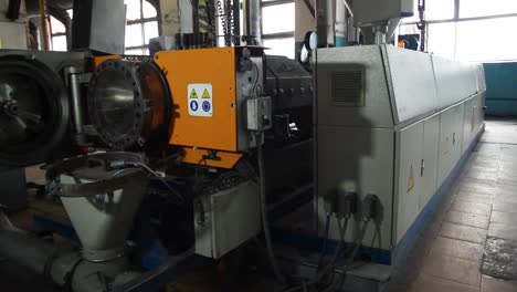 plastic extrusion machine in a factory