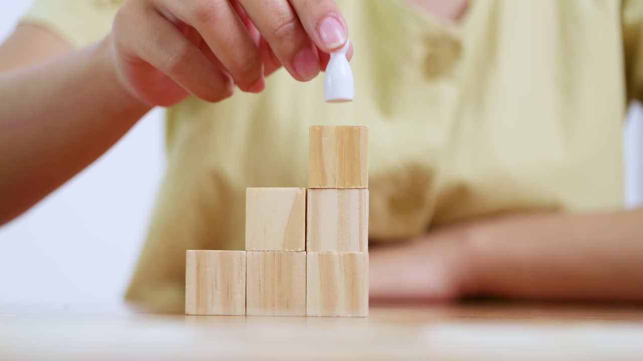 A child explores creativity by stacking wooden blocks fostering imagination and motor skills