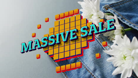 animation of massive sale text over denim trousers on grey background