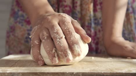 woman kneading dough