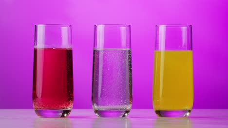 three different drinks in glasses