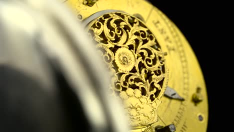 close-up of a vintage pocket watch mechanism