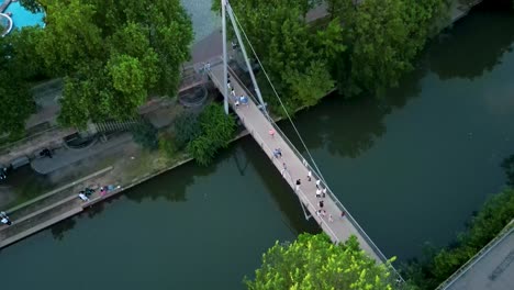 4k aerial drone video of the cinecitta bridge across the pegnitz river in downtown nurnberg, germany