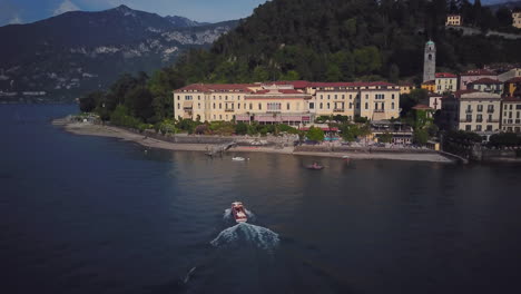 aerial view of lake como resort with boat