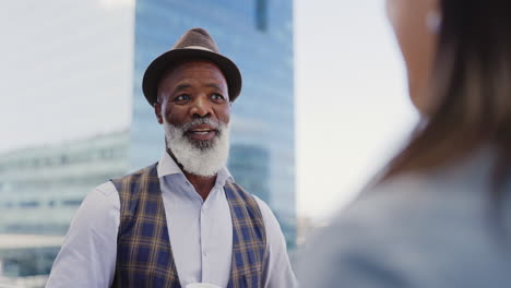 city, black man and woman on rooftop networking