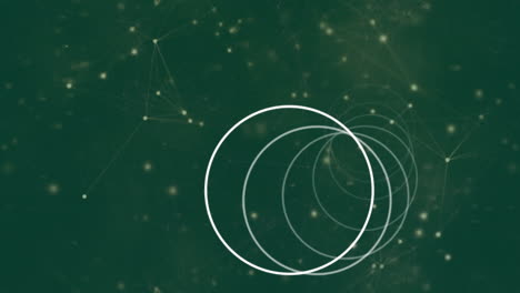 Animation of white rings rotating, over network of connections on green background