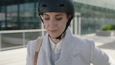 portrait of confident young business woman executive wearing helmet looking positive leaving work enjoying independent urban lifestyle