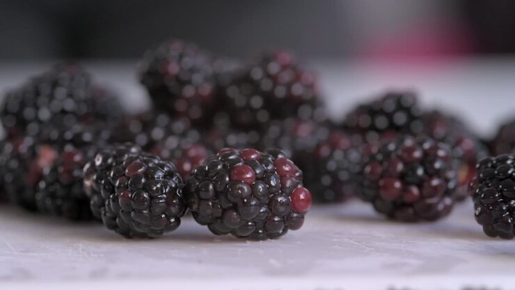 Close on Blackberries Poured Onto Chopping Board