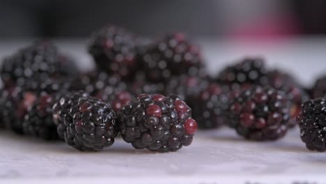 close on blackberries poured onto chopping board