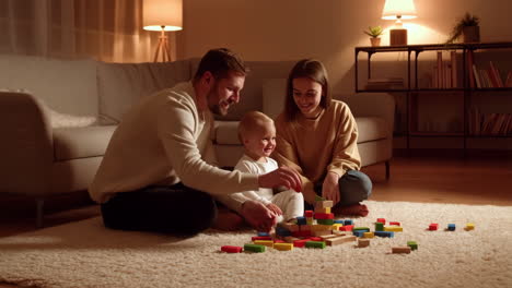 family playing with colorful wooden blocks in a cozy living room