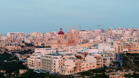 aerial view around the mellieha parish church, colorful sunset in malta