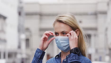 Side-view-of-Caucasian-woman-wearing-a-coronavirus-Covid19-mask