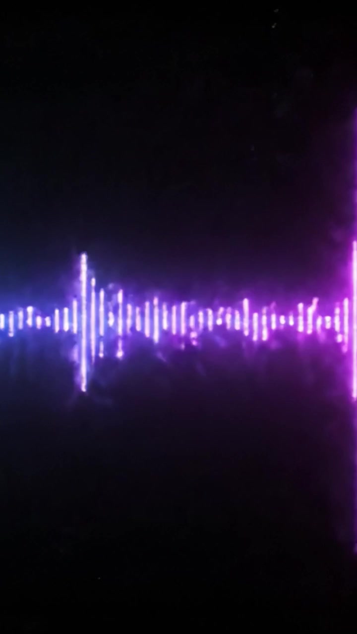 A Captivating Visual Display of Sound Waves in Dynamic Colors: From Blue Vibrations to a Stunning Pink Pulse, Illustrating the Essence of Audio Artistry