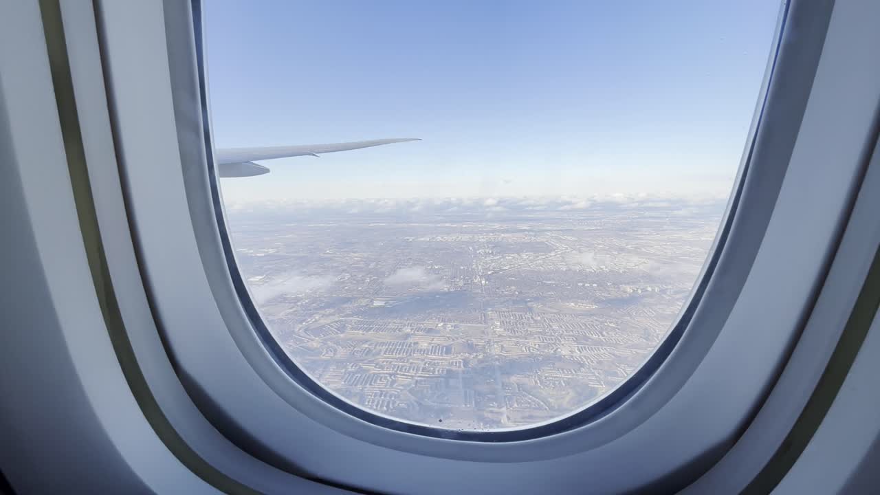 Cabin Window View Of A Aeroplane Wing Over An Australian Landscape During A Plane Flight.