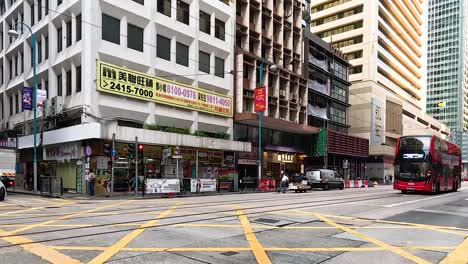 buses and cars navigate busy city intersection